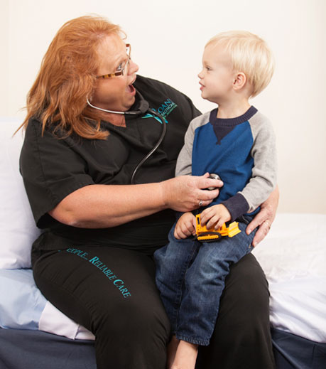 Ohioans Home Healthcare Nurse performing in-home pediatric care on child as part of home health services.