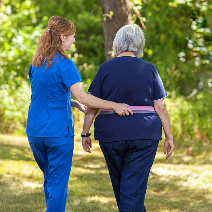 Ohioans Home Health Care nurse helping patient walk. Home healthcare agencies in Ohio and Michigan