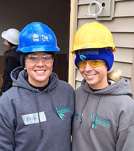 Image of Ohioans employees in construction hats helping the community.