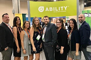 Group image in front of Ability sign