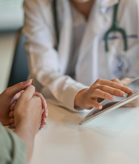 Shot of a doctor showing a patient some information on a digital tablet