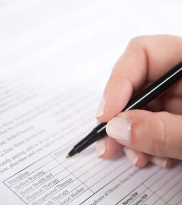 Image of new patient filling out form.